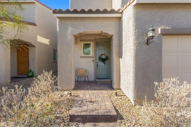 property entrance featuring a garage