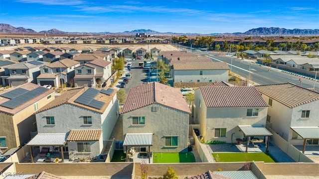 birds eye view of property with a mountain view