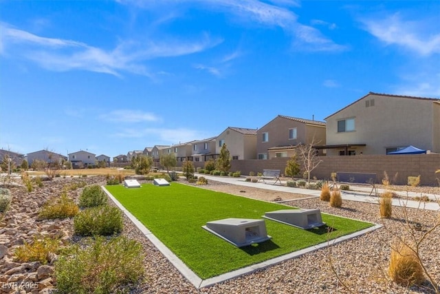 view of property's community featuring a lawn