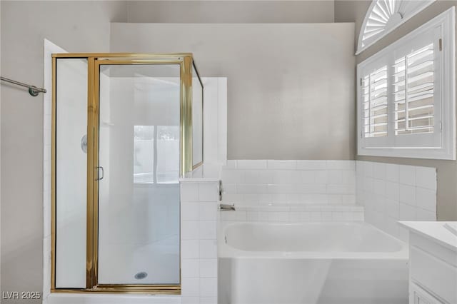 bathroom with independent shower and bath and vanity