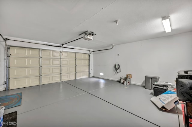 garage featuring a garage door opener