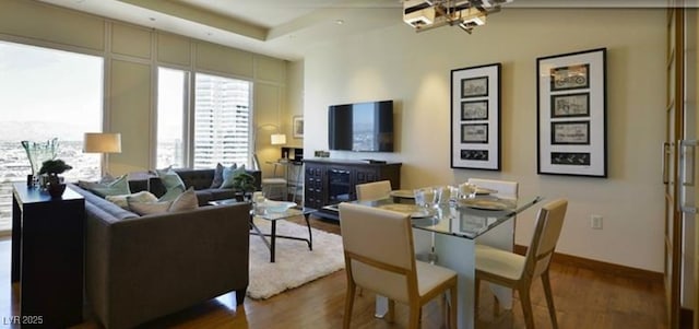 dining room featuring dark wood-type flooring and an inviting chandelier