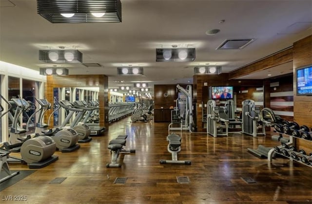 workout area with wood-type flooring