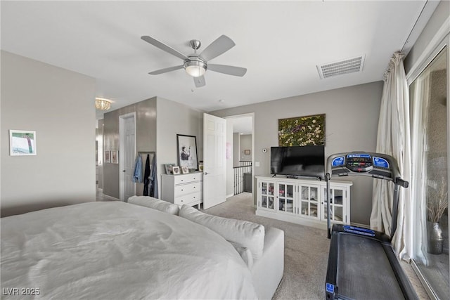 bedroom featuring ceiling fan and light colored carpet