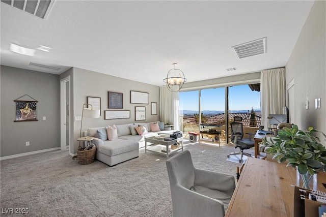 living room with a chandelier and carpet