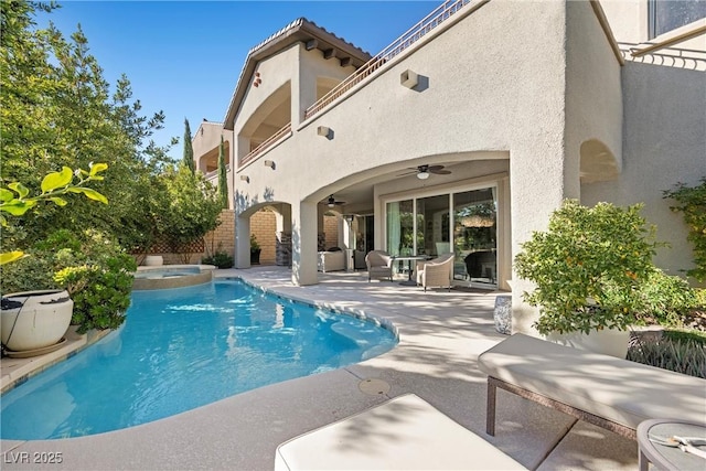 view of pool featuring ceiling fan, an in ground hot tub, and a patio