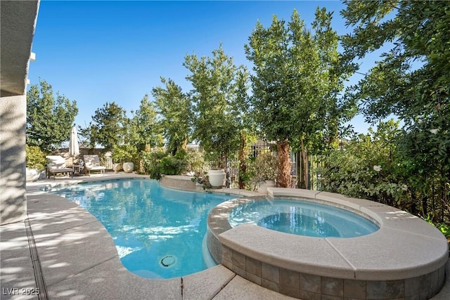 view of swimming pool with an in ground hot tub