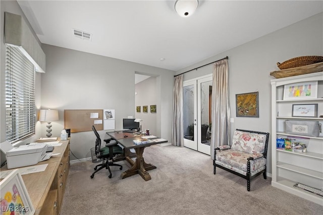 office space featuring light colored carpet and french doors