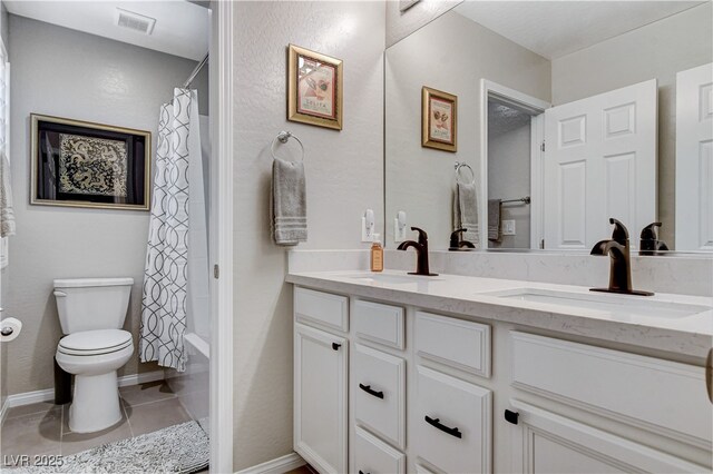 full bathroom with toilet, shower / bath combo with shower curtain, tile patterned floors, and vanity