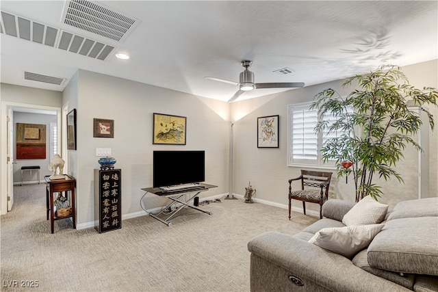 living room featuring ceiling fan and light carpet