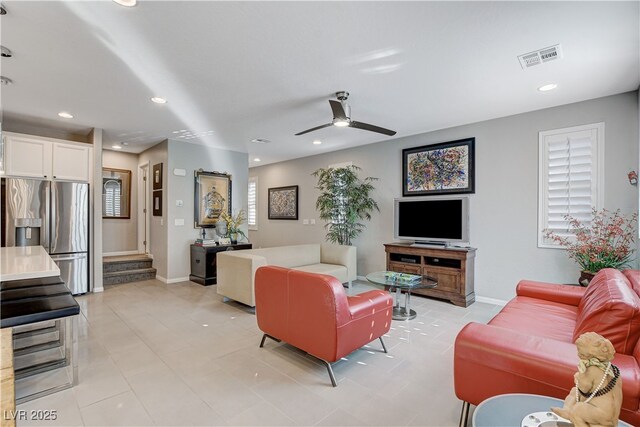 living room featuring ceiling fan