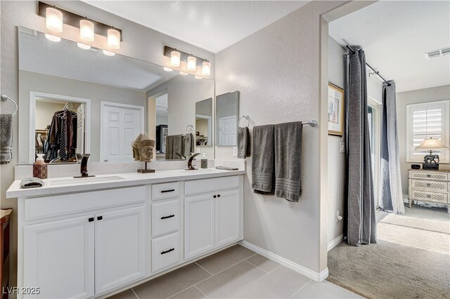 bathroom featuring tile patterned floors and vanity