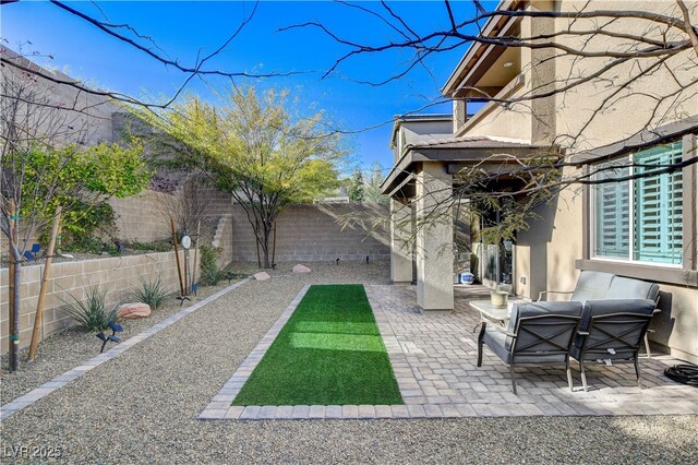 view of yard with outdoor lounge area and a patio area