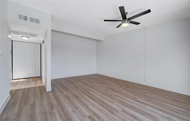 interior space with ceiling fan and light wood-type flooring