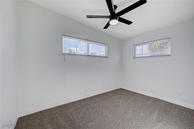 unfurnished room featuring vaulted ceiling, ceiling fan, and carpet