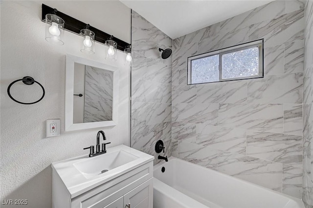 bathroom featuring vanity and tiled shower / bath combo