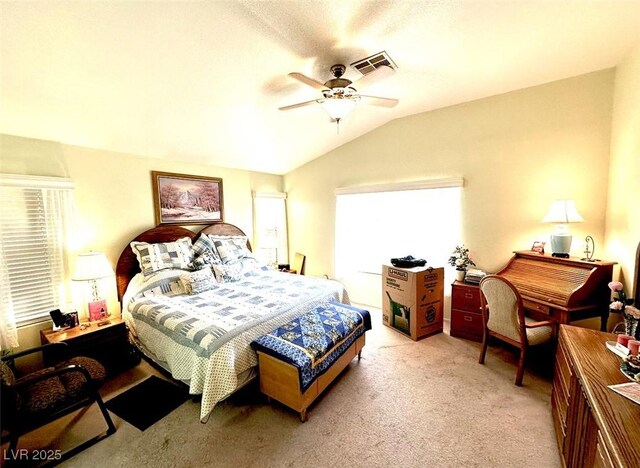 bedroom with ceiling fan, light colored carpet, multiple windows, and vaulted ceiling