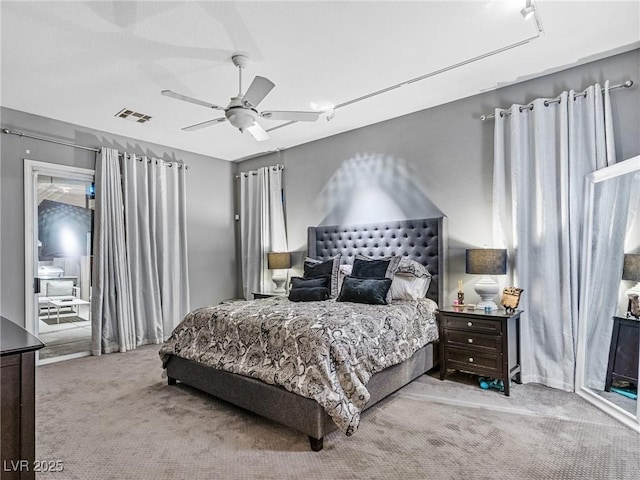 bedroom featuring ceiling fan and light colored carpet