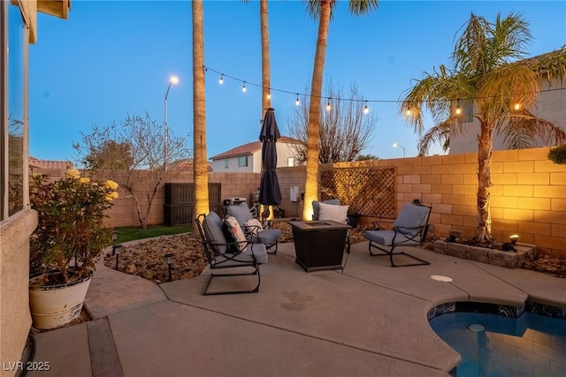 view of patio / terrace featuring an outdoor fire pit and a fenced in pool