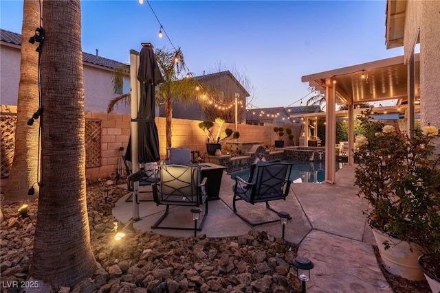 view of patio terrace at dusk