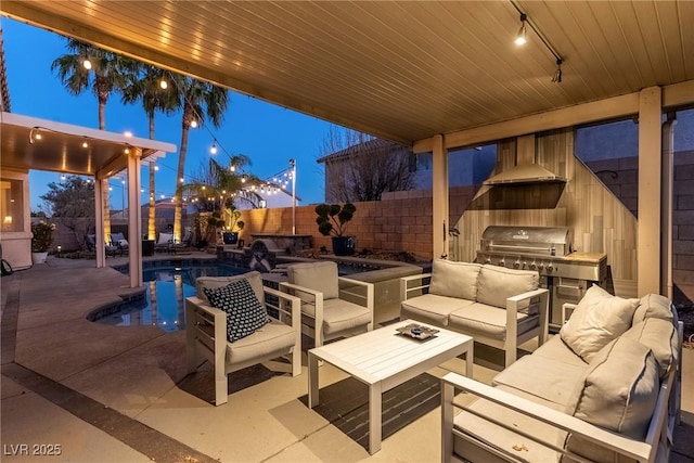 patio terrace at dusk with grilling area, an outdoor hangout area, and a fenced in pool