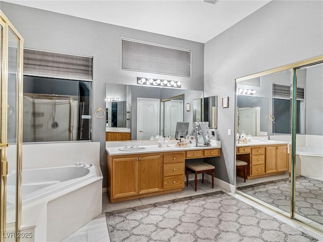 bathroom with vanity, tile patterned flooring, and separate shower and tub