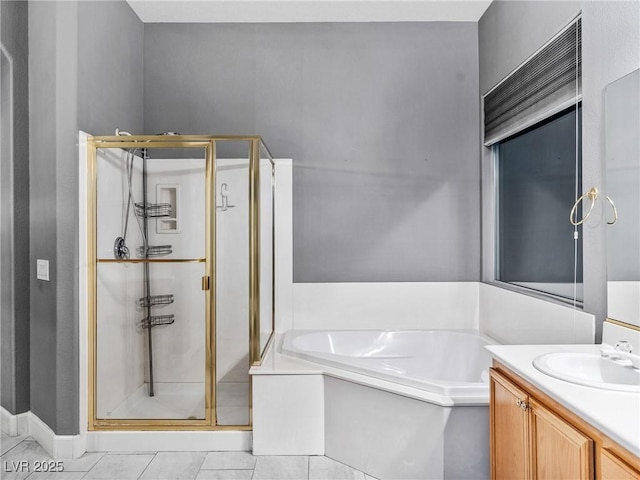 bathroom featuring vanity, tile patterned floors, and plus walk in shower