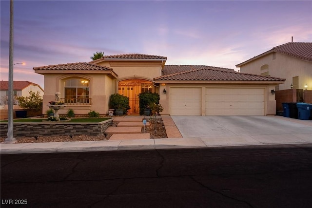 mediterranean / spanish-style house featuring a garage