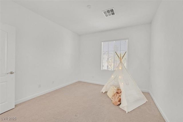 game room with light colored carpet