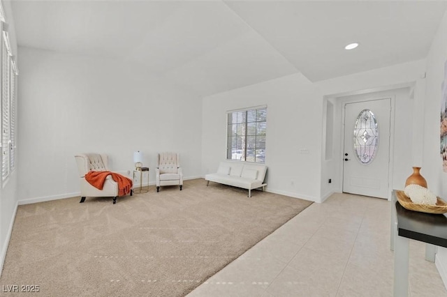 view of carpeted entrance foyer