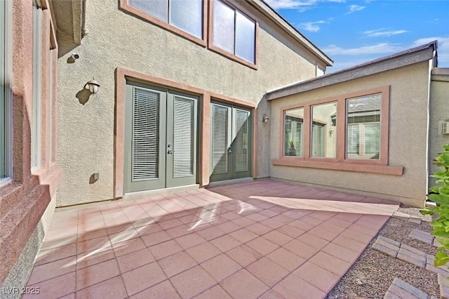 view of patio featuring french doors