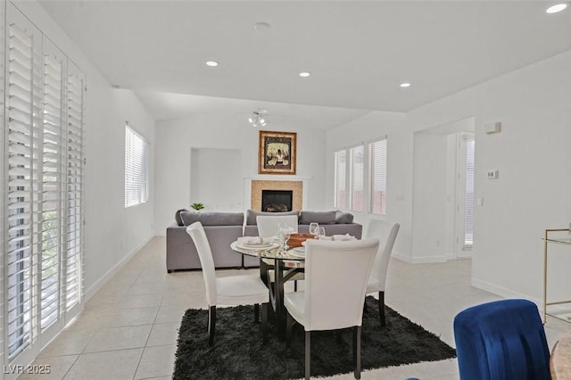 tiled dining area featuring ceiling fan