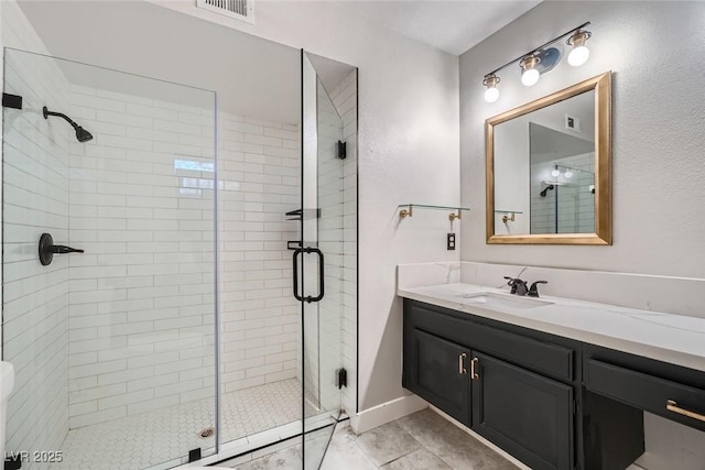 bathroom with an enclosed shower and vanity