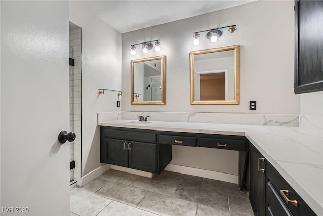 bathroom with vanity and a shower with shower door