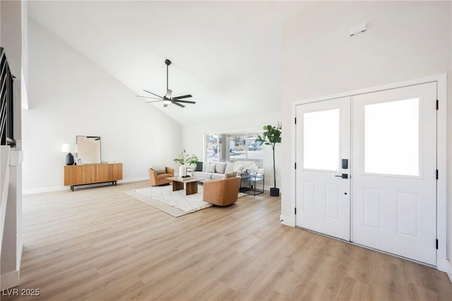 entryway featuring high vaulted ceiling, light wood-type flooring, and ceiling fan