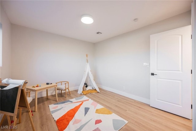 recreation room featuring hardwood / wood-style floors