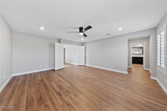 unfurnished bedroom with hardwood / wood-style flooring and ceiling fan