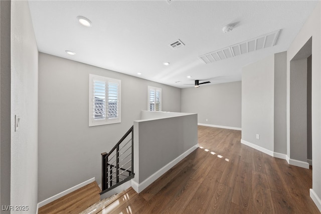 hall with dark hardwood / wood-style floors