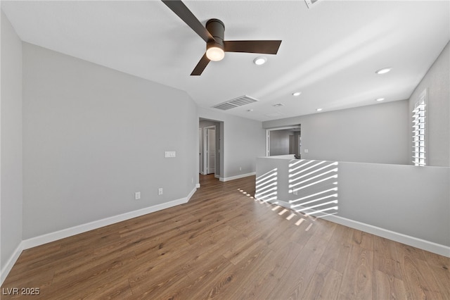 empty room featuring hardwood / wood-style flooring and ceiling fan