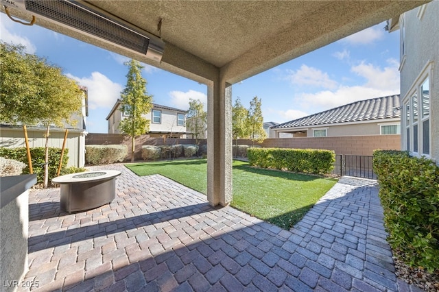 view of patio / terrace with an outdoor fire pit