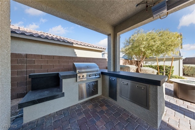 view of patio / terrace with exterior kitchen and grilling area