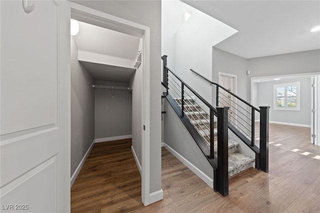 stairs featuring wood-type flooring