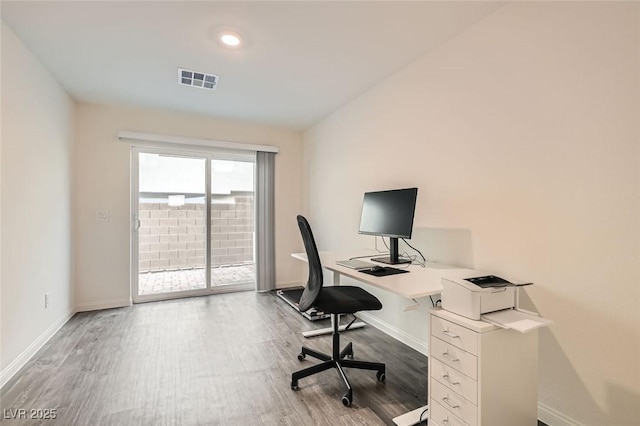 office space with wood-type flooring