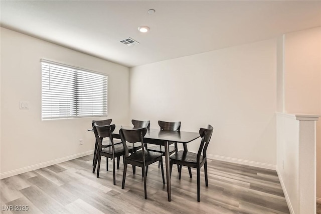 dining room with light wood-type flooring