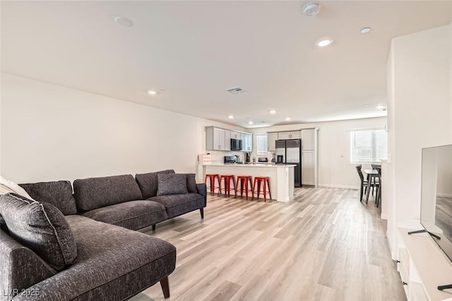 living room featuring light wood-type flooring