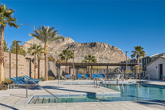 view of pool featuring a patio and a mountain view