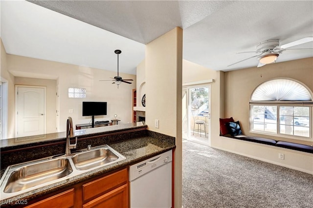 kitchen with sink, carpet flooring, ceiling fan, and dishwasher