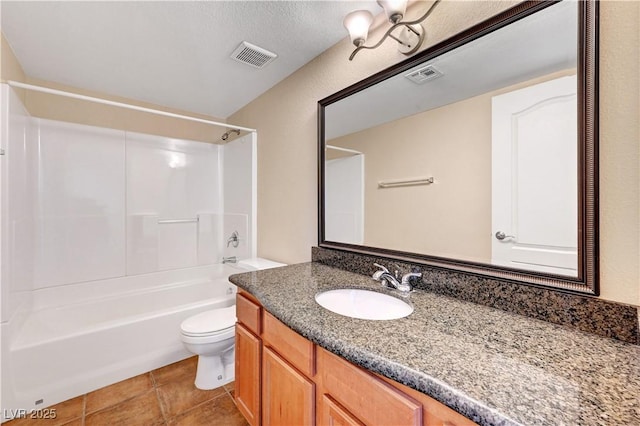 full bathroom featuring toilet, a textured ceiling, tile patterned flooring, bathing tub / shower combination, and vanity