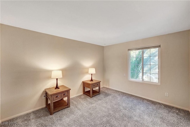 unfurnished room featuring light carpet