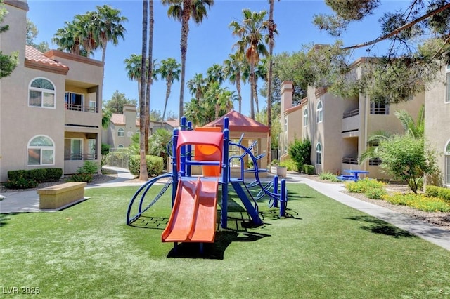 view of jungle gym with a lawn